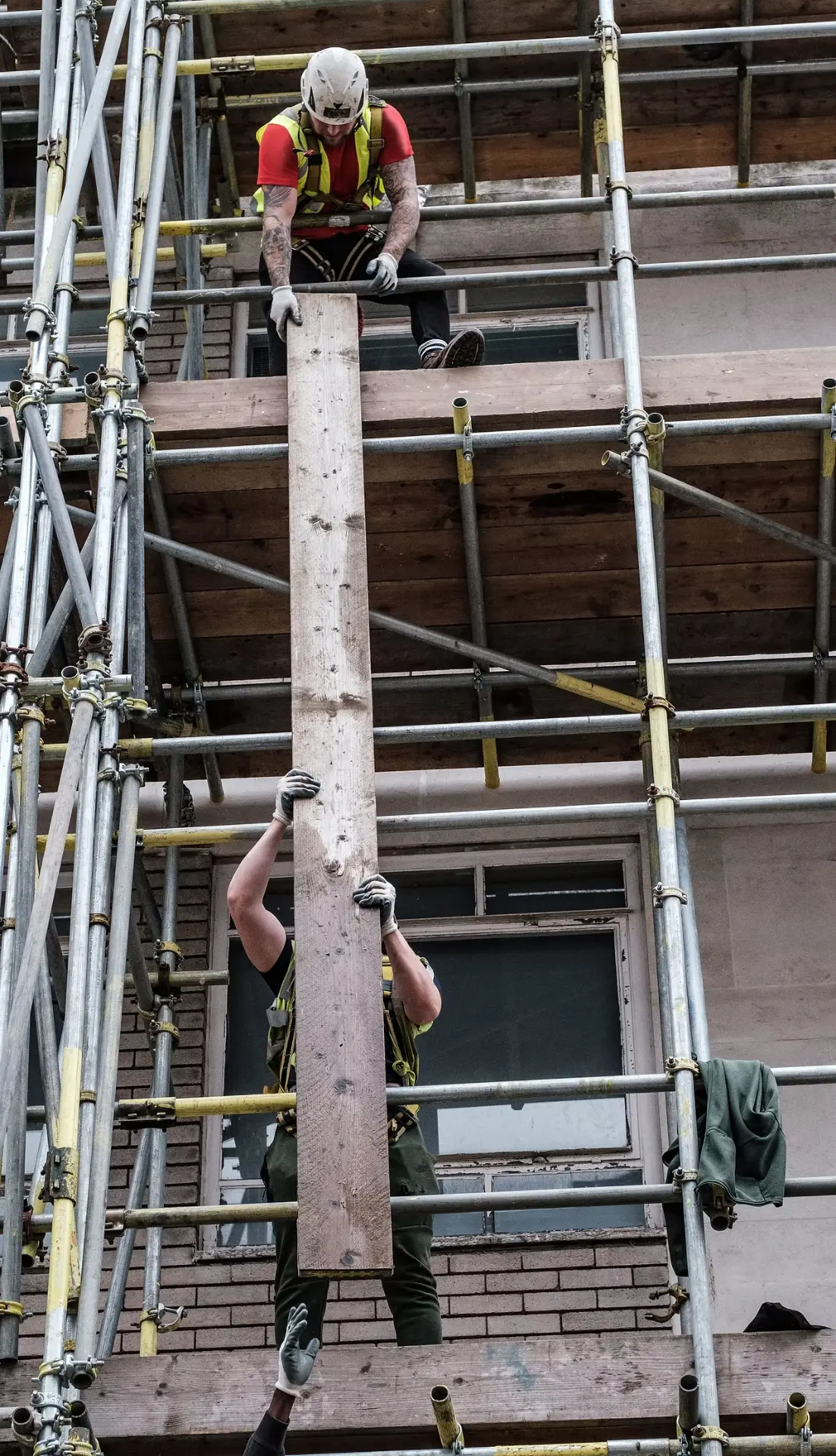 SWS team members installing on scaffolding